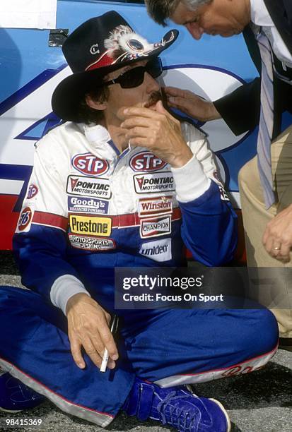 Nascar driver Richard Petty in this portrait sitting next to the STP car February 18, 1990 before the Nascar Winston Cup Daytona 500 race at Daytona...