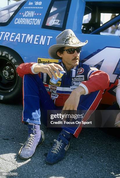 Nascar driver Richard Petty in this portrait sitting next to the STP car February 15, 1987 before the Nascar Winston Cup Daytona 500 race at Daytona...