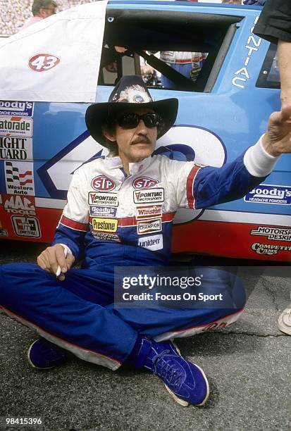Nascar driver Richard Petty in this portrait sitting next to the STP car February 18, 1990 before the Nascar Winston Cup Daytona 500 race at Daytona...