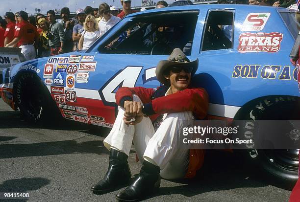 Nascar driver Richard Petty in this portrait sitting next to the STP car February 20, 1983 before the Nascar Winston Cup Daytona 500 race at Daytona...