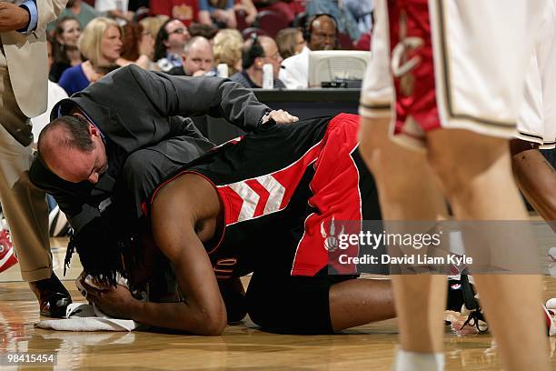 Chris Bosh of the Toronto Raptors lays on the court after getting hit in the face during the game against the Cleveland Cavaliers on April 6, 2010 at...