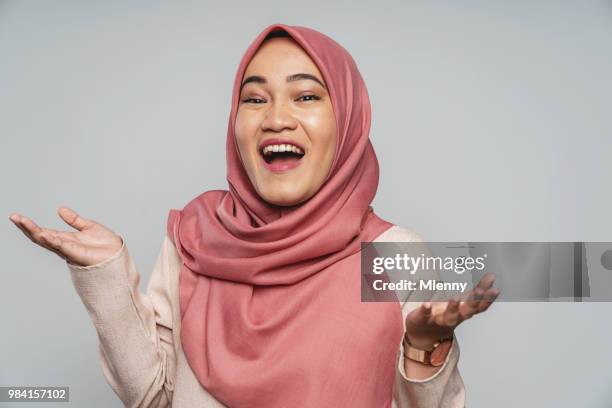 happy laughing malaysian woman studio portrait - funny muslim stock pictures, royalty-free photos & images