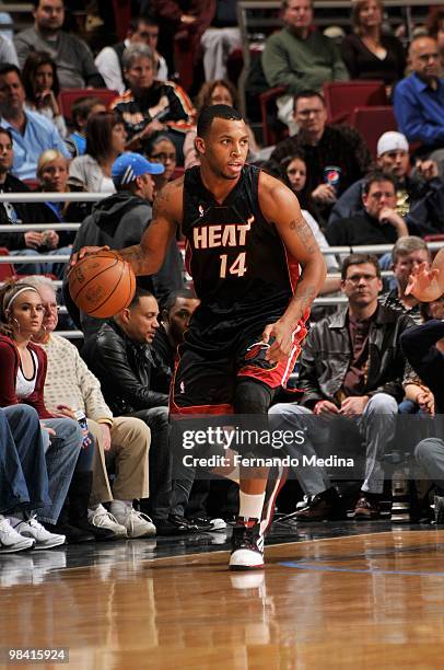 Daequan Cook of the Miami Heat moves the ball against the Orlando Magic during the game on February 28, 2010 at Amway Arena in Orlando, Florida. The...