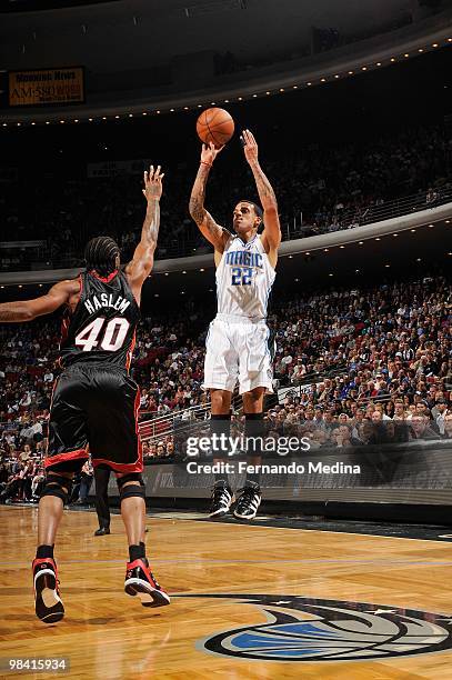 Matt Barnes of the Orlando Magic takes a jump shot against Udonis Haslem of the Miami Heat during the game on February 28, 2010 at Amway Arena in...