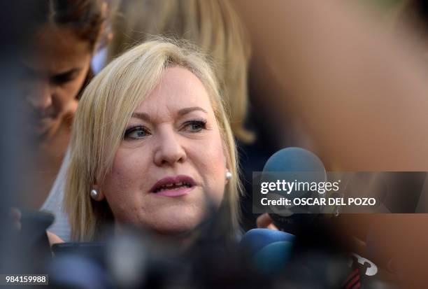 Ines Madrigal, a railway worker who heads the Murcia branch of SOS Stolen Babies association, arrives at a provincial court in Madrid, on June 26,...