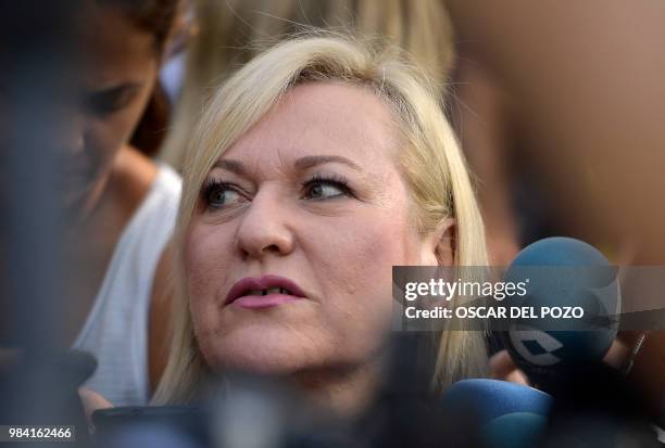 Ines Madrigal, a railway worker who heads the Murcia branch of SOS Stolen Babies association, arrives at a provincial court in Madrid, on June 26,...