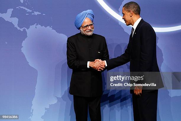 President Barack Obama welcomes Indian Prime Minister Manmohan Singh at the start of the Nuclear Security Summit at the Washington Convention Center...