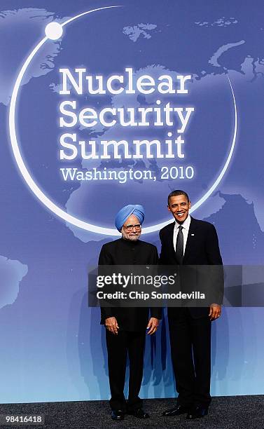 President Barack Obama poses for photographs with Indian Prime Minister Manmohan Singh at the start of the Nuclear Security Summit at the Washington...