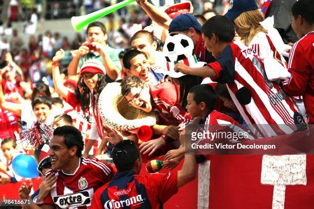 Jesus Padilla of Chivas USA returns to the field after celebrating his second goal of the match with the fans in in the second half of their MLS...
