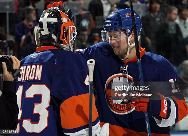 Josh Bailey and Martin Biron of the New York Islanders celebrate against the Ottawa Senators on April 3, 2010 at Nassau Coliseum in Uniondale, New...