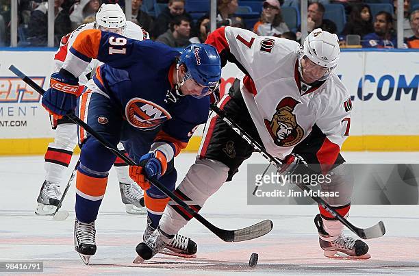 John Tavares of the New York Islanders skates against Matt Cullen of the Ottawa Senators on April 3, 2010 at Nassau Coliseum in Uniondale, New York....