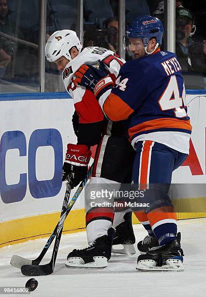 Freddy Meyer of the New York Islanders skates against Jarkko Ruutu of the Ottawa Senators on April 3, 2010 at Nassau Coliseum in Uniondale, New York....
