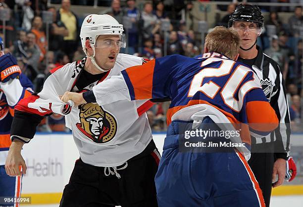 Nick Foligno of the Ottawa Senators fights Sean Bergenheim of the New York Islanders on April 3, 2010 at Nassau Coliseum in Uniondale, New York. The...