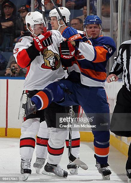 Peter Regin of the Ottawa Senators skates against Sean Bergenheim of the New York Islanders on April 3, 2010 at Nassau Coliseum in Uniondale, New...