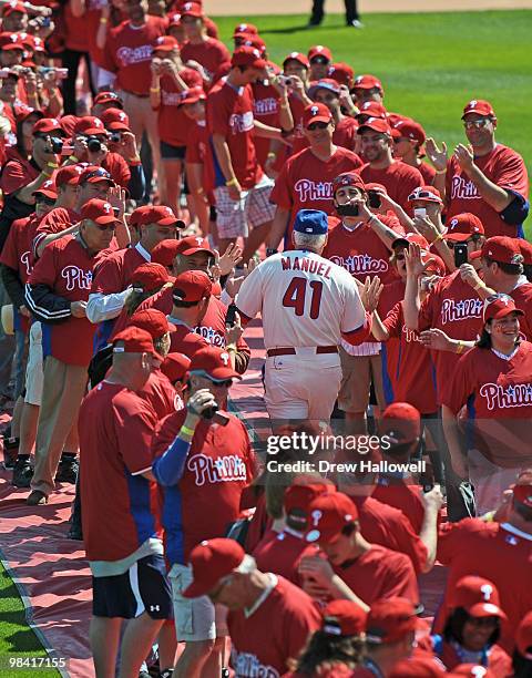 Manager Charlie Manuel of the Philadelphia Phillies walks onto the field before the game against the Washington Nationals on Opening Day at Citizens...