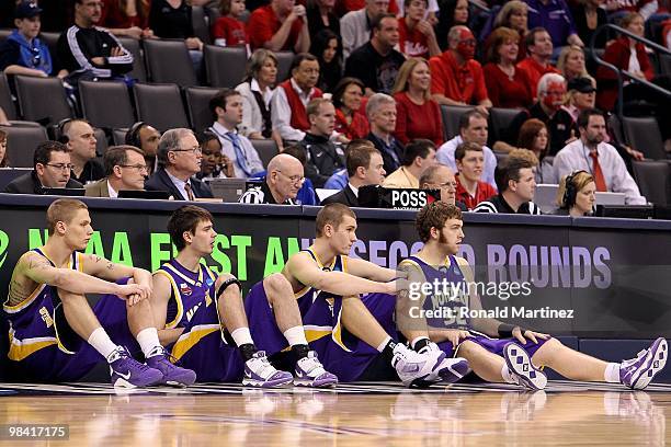 Marc Sonnen, Kerwin Dunham, Jake Koch and Lucas O'Rear of the Northern Iowa Panthers sit next to the score's table against the UNLV Rebels during the...