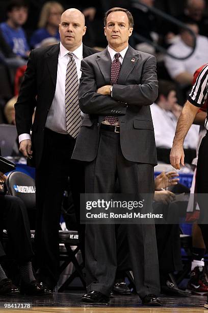 Head coach Lon Kruger and assitant coach Steve Henson of the UNLV Rebels look on against the Northern Iowa Panthers during the first round of the...