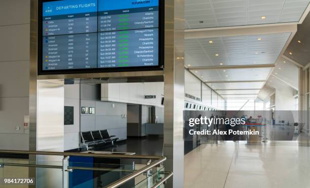 all on time! informational tableau with flights schedule in the airport lounge - alex potemkin or krakozawr stock pictures, royalty-free photos & images