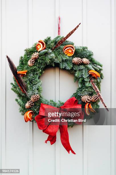 christmas wreath with pheasant feathers - flower garland stock pictures, royalty-free photos & images