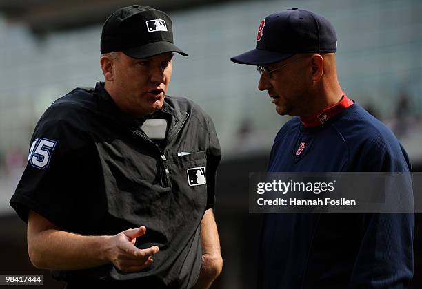 Manager Terry Francona of the Boston Red Sox speaks with homeplate umpire Jeff Nelson in the first inning after Marco Scutaro was caught stealing...