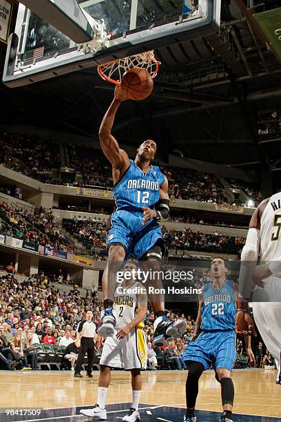 Dwight Howard of the Orlando Magic jams over Earl Watson of the Indiana Pacers at Conseco Fieldhouse on April 12, 2010 in Indianapolis, Indiana. NOTE...