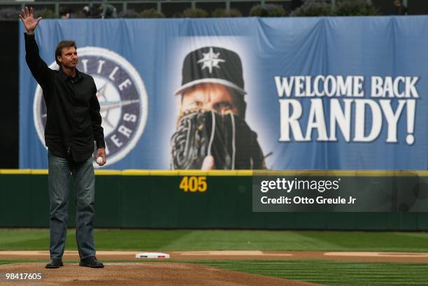 Former Mariners star Randy Johnson waves to the crowd prior to throwing out the ceremonial first pitch before the Mariners' home opener against the...