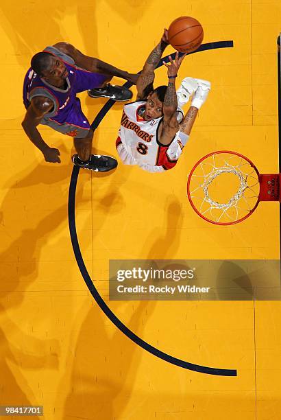 Monta Ellis of the Golden State Warriors takes the ball to the baskaet against Jason Richardson of the Phoenix Suns during the game at Oracle Arena...