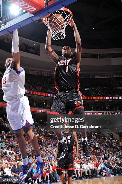 Dorell Wright of the Philadelphia 76ers dunks the ball against Andre Iguodala of the Miami Heat during the game on April 12, 2010 at the Wachovia...