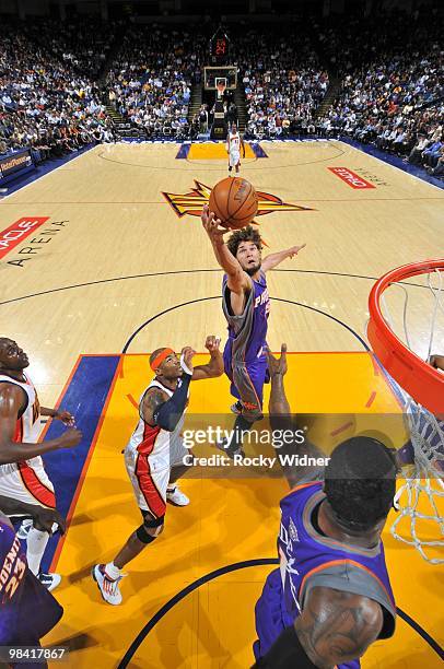 Robin Lopez of the Phoenix Suns rebounds against Corey Maggette of the Golden State Warriors during the game at Oracle Arena on March 22, 2010 in...