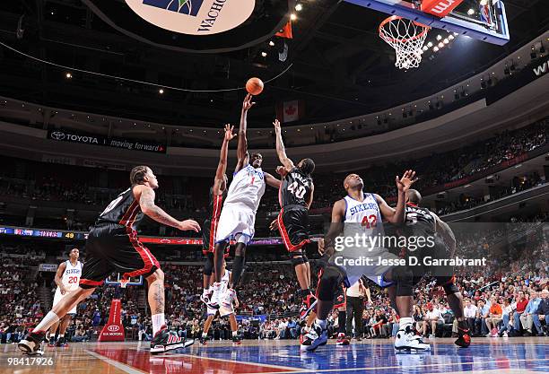 Samuel Dalembert of the Philadelphia 76ers shoots against Udonis Haslem of the Miami Heat during the game on April 12, 2010 at the Wachovia Center in...