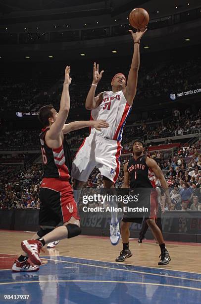 Charlie Villanueva of the Detroit Pistons goes up for a shot attempt against Hedo Turkoglu of the Toronto Raptors in a game at the Palace of Auburn...