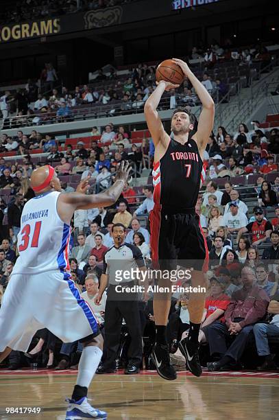 Andrea Bargnani of the Toronto Raptors goes up for a shot attempt over Charlie Villanueva of the Detroit Pistons in a game at the Palace of Auburn...