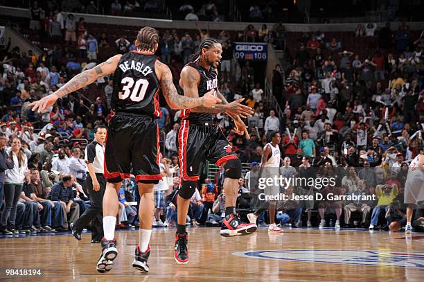 Michael Beasley and Udonis Haslem of the Miami Heat celebrate their win against the Philadelphia 76ers on April 12, 2010 at the Wachovia Center in...