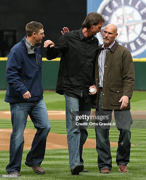 Former Mariners stars Dan Wilson, Randy Johnson, and Jay Buhner greet each other pitch prior to the Mariners' home opener against the Oakland...