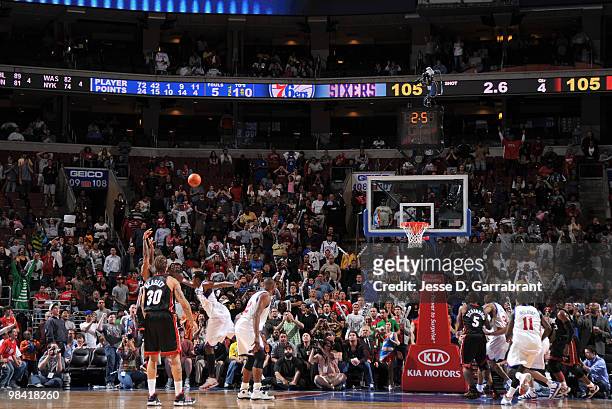 Udonis Haslem of the Miami Heat shoots the game winning shot against Samuel Dalembert of the Philadelphia 76ers during the game on April 12, 2010 at...