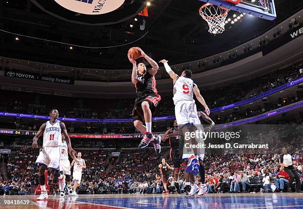Michael Beasley of the Miami Heat shoots against Andre Iguodala of the Philadelphia 76ers during the game on April 12, 2010 at the Wachovia Center in...