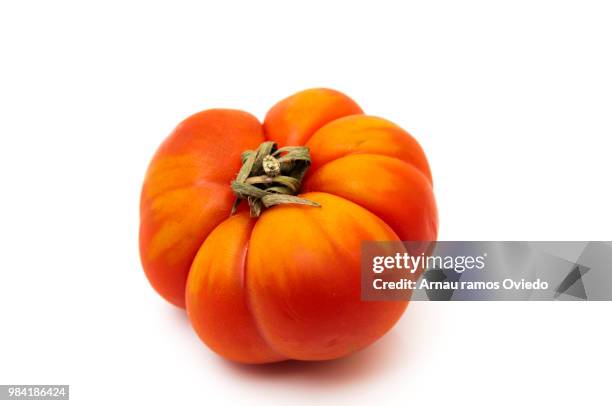 tomato with streaks - beefsteak tomato stock pictures, royalty-free photos & images