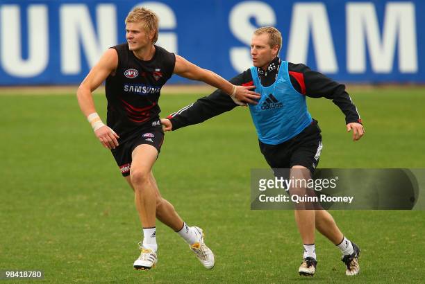 Michael Hurley and Matthew Knights the coach of the Bombers contest during the Essendon Bombers AFL training session at Windy Hill on April 13, 2010...