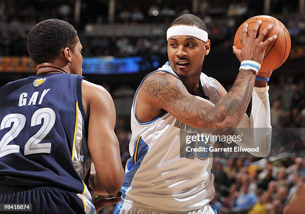 Carmelo Anthony of the Denver Nuggets goes to the basket against Rudy Gay of the Memphis Grizzlies on April 12, 2010 at the Pepsi Center in Denver,...