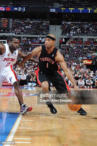 Jarrett Jack of the Toronto Raptors drives around Will Bynum of the Detroit Pistons in a game at the Palace of Auburn Hills on April 12, 2010 in...