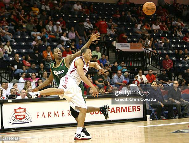 Jonathan Wallace of the Rio Grande Valley Vipers battles for a loose ball with DJ Strawberry of the Reno Bighorns on April 12, 2010 at the State Farm...