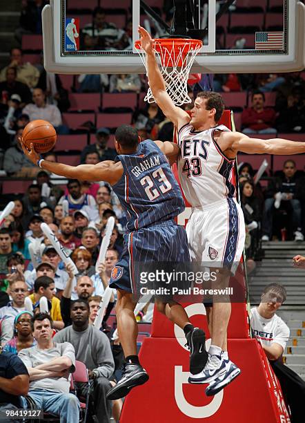 Stephen Graham of the Charlotte Bobcats shoots against Kris Humphries of the New Jersey Nets on April 12, 2010 during the last Nets game at The Izod...