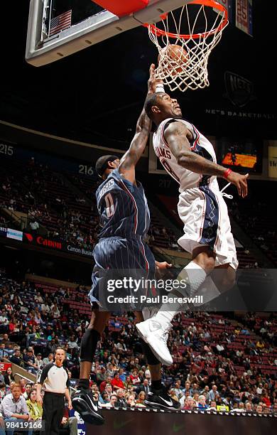 Terrence Williams of the New Jersey Nets shoots against Larry Hughes of the Charlotte Bobcats on April 12, 2010 during the last Nets game at The Izod...