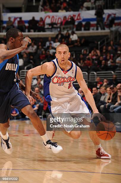 Steve Blake of the Los Angeles Clippers dribbles against Rodrique Beaubois of the Dallas Mavericks at Staples Center on April 12, 2010 in Los...