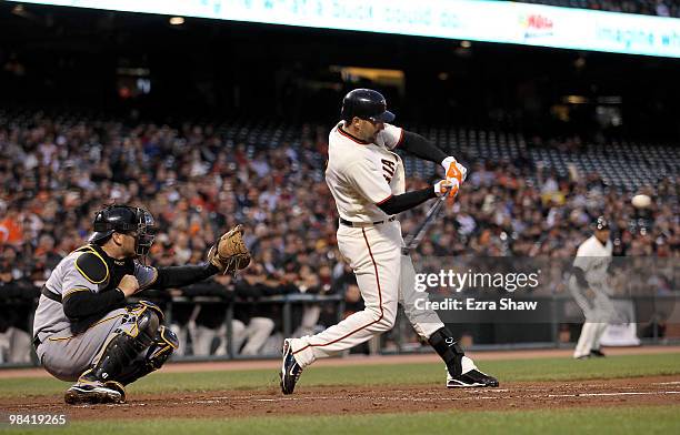 Mark DeRosa of the San Francisco Giants hits a two run single in the first inning of their game against the Pittsburgh Pirates at AT&T Park on April...