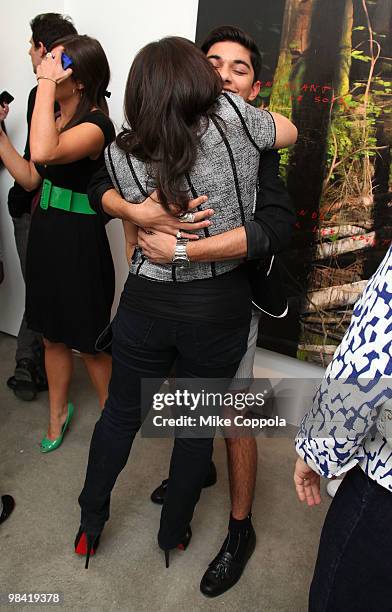 Actors America Ferrera and Mark Indelicato hug at an "Ugly Betty" charity auction benefiting Save the Children at Axelle Fine Arts Gallery Ltd on...