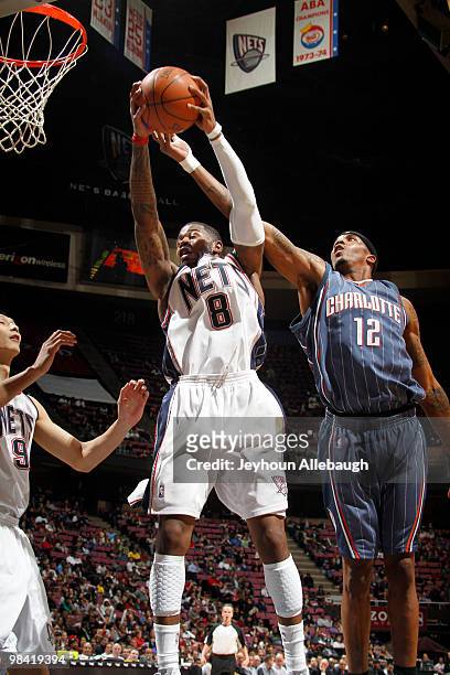 Terrence Williams of the New Jersey Nets shoots against Tyrus Thomas of the Charlotte Bobcats on April 12, 2010 during the last Nets game at The Izod...