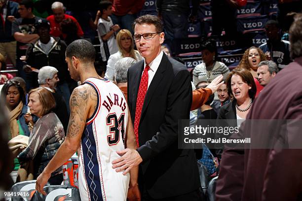 Coach Kiki Vandeweghe of the New Jersey Nets exits the court with Devin Harris after their team fell to the Charlotte Bobcats on April 12, 2010...