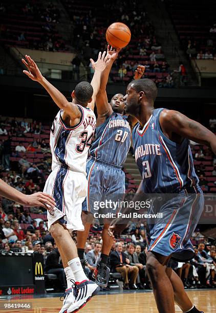 Raymond Felton of the Charlotte Bobcats shoots against Devin Harris of the New Jersey Nets on April 12, 2010 during the last Nets game at The Izod...
