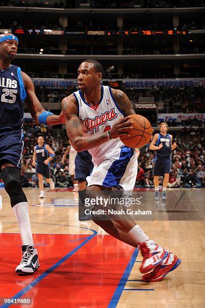 Rasual Butler of the Los Angeles Clippers drives to the basket against Erick Dampier of the Dallas Mavericks at Staples Center on April 12, 2010 in...